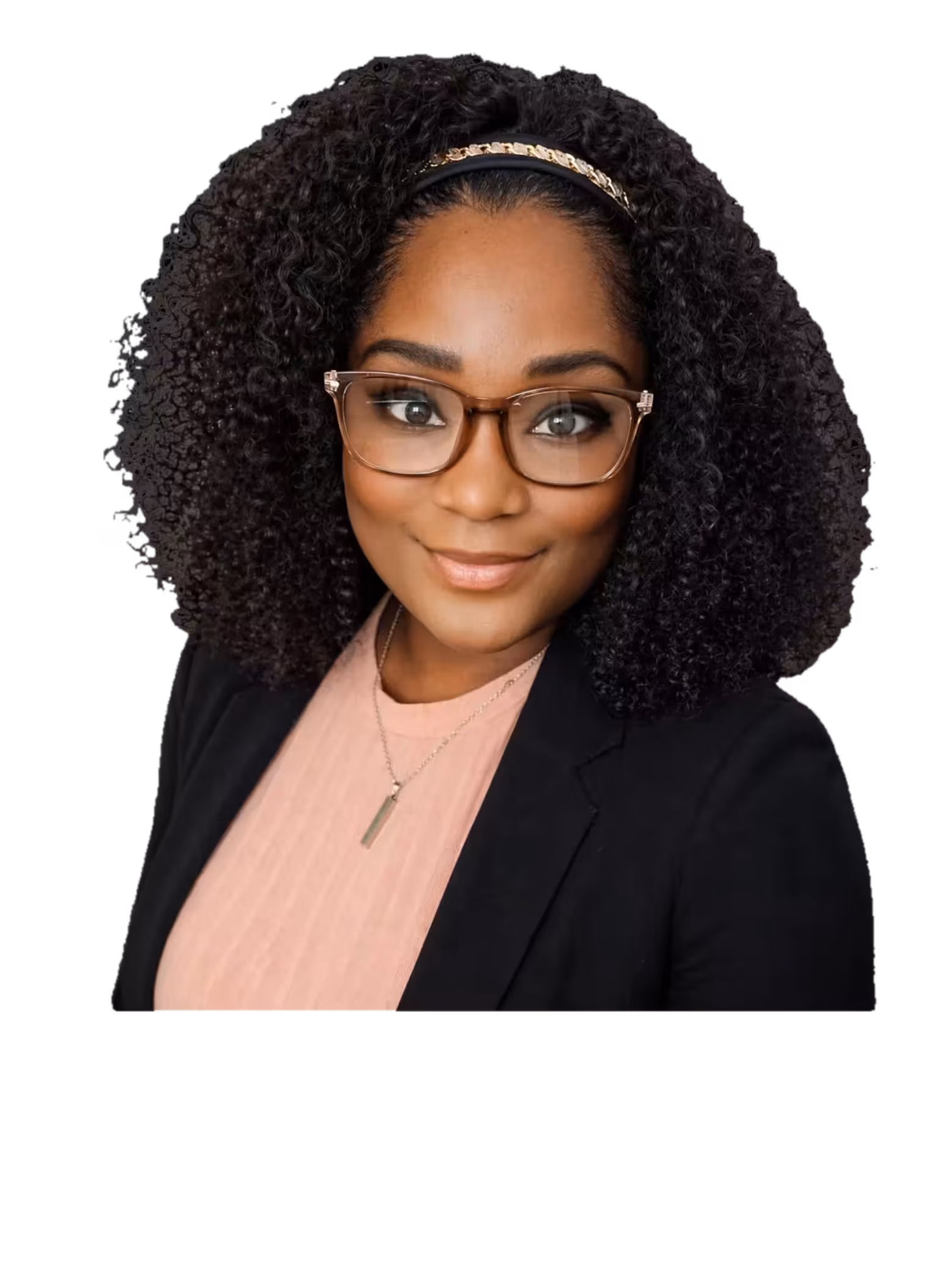 Smiling woman with curly hair, glasses, black blazer, and pink top on black background.