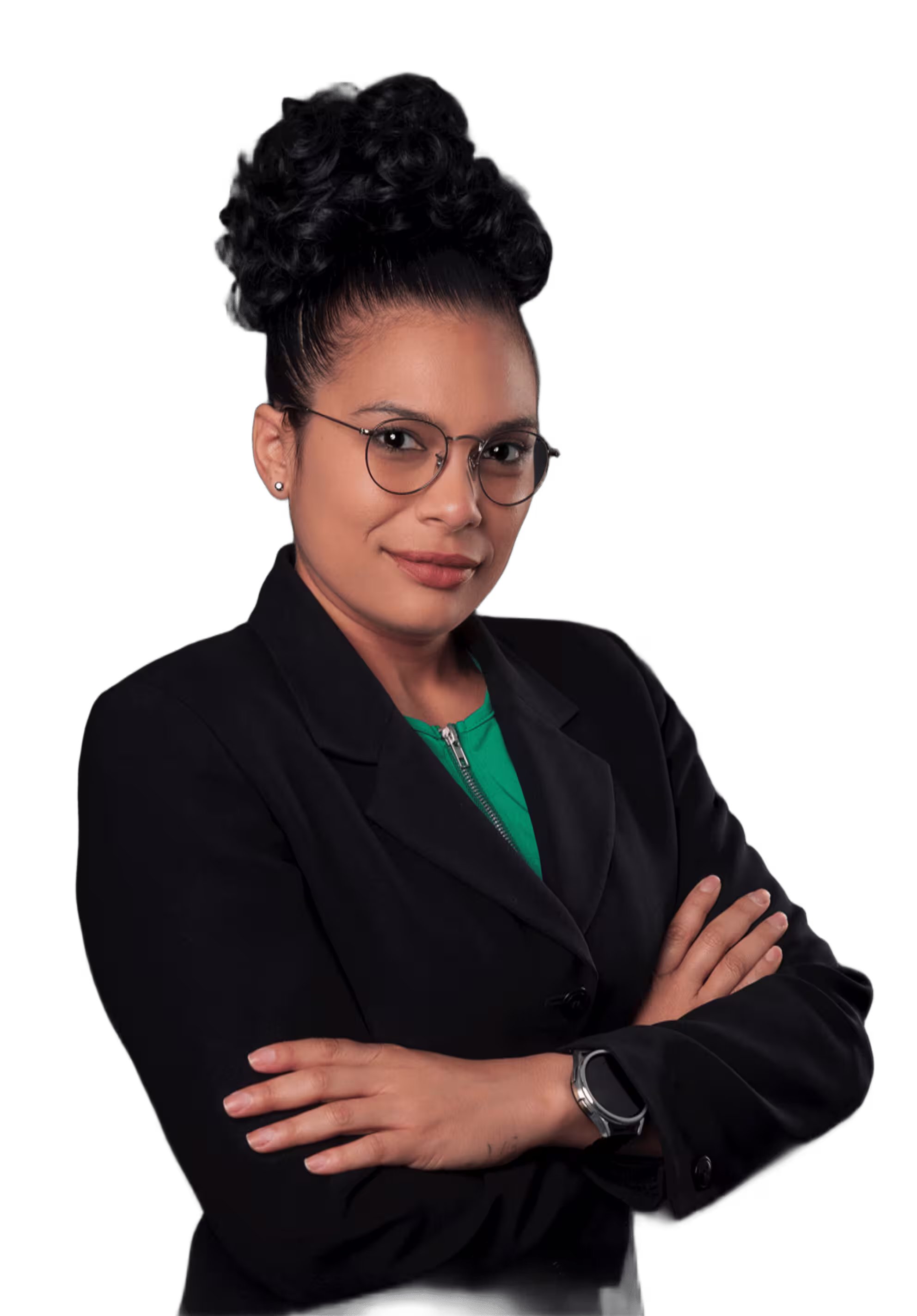 Confident woman with glasses and curly hair in black blazer and green top with arms crossed.