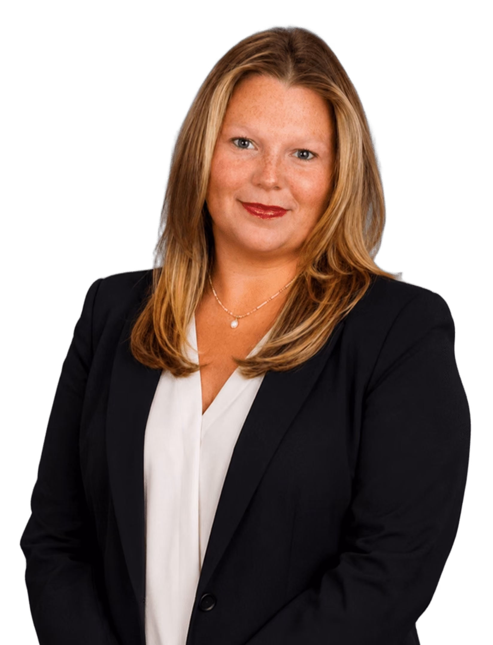 Smiling woman with blonde hair in a black blazer and white blouse wearing a necklace.