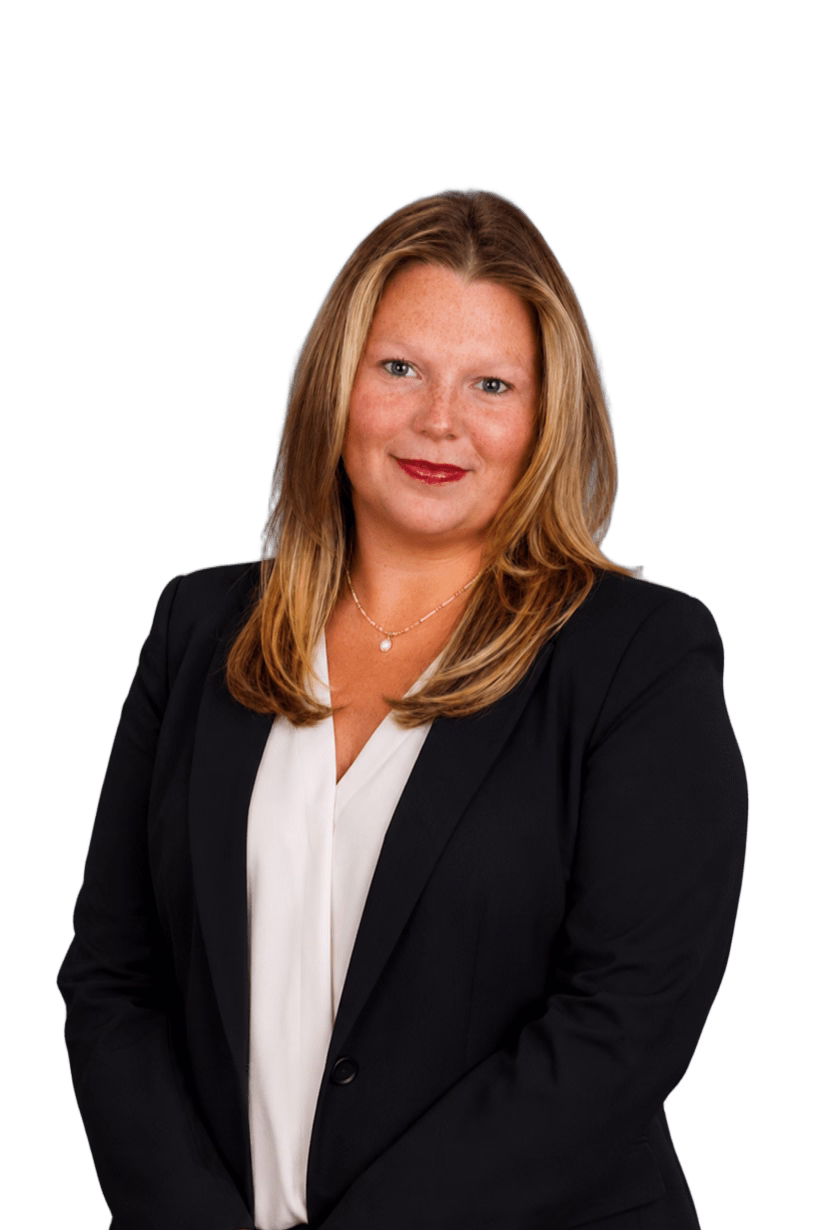 Smiling woman with blonde hair in a black blazer and white blouse wearing a necklace.