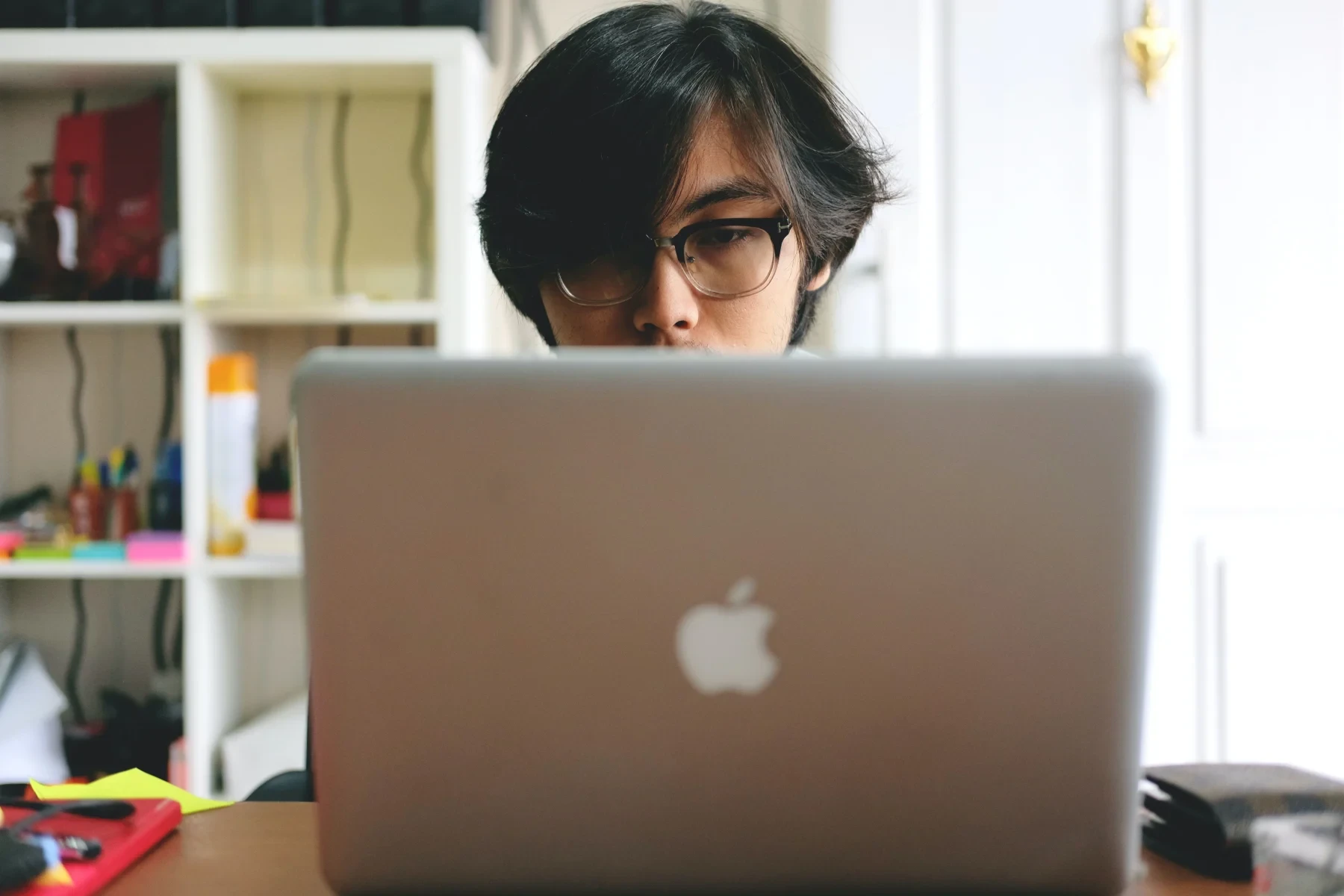 A boy behind a computer