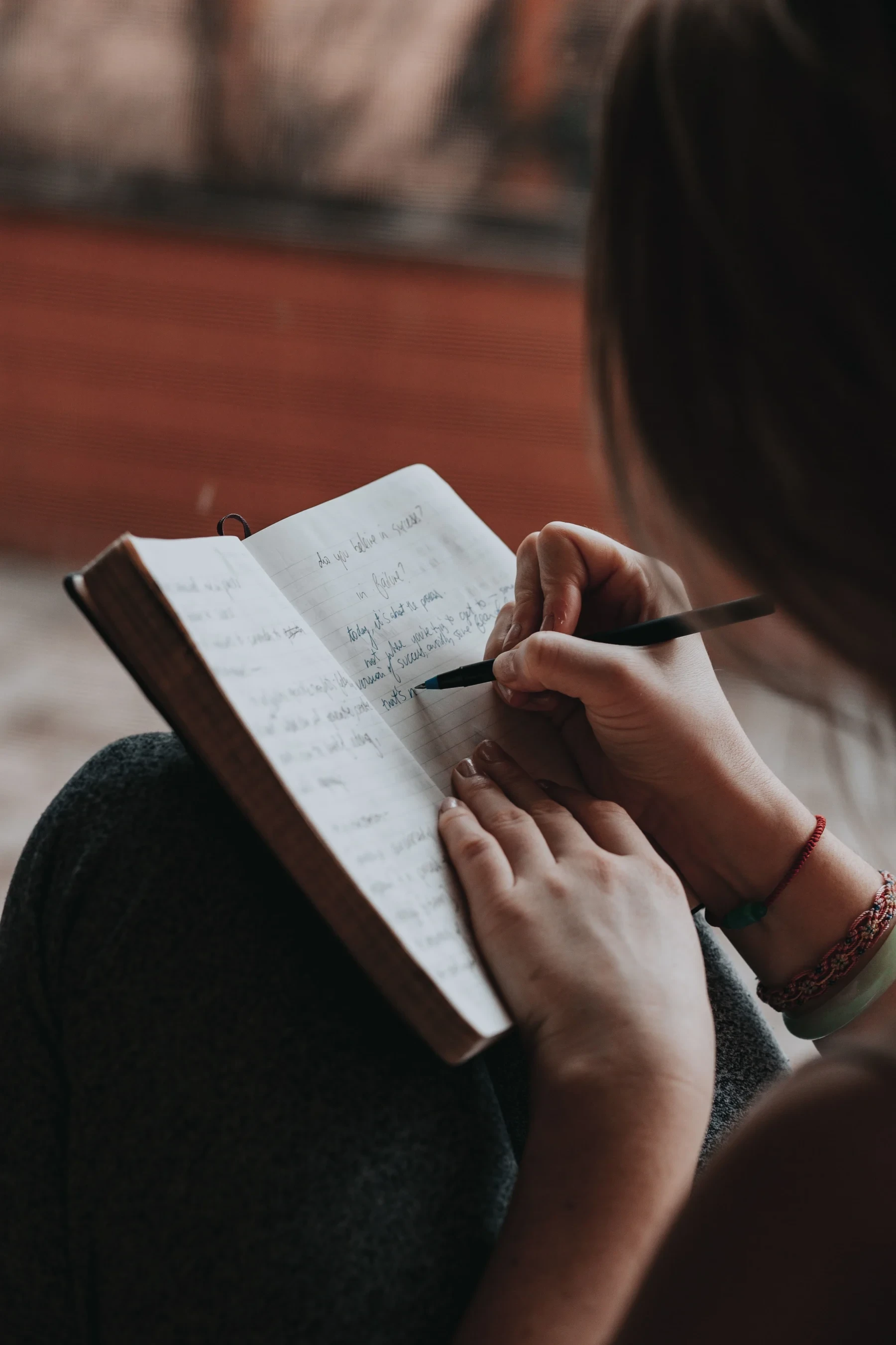 A girl writing in notebook