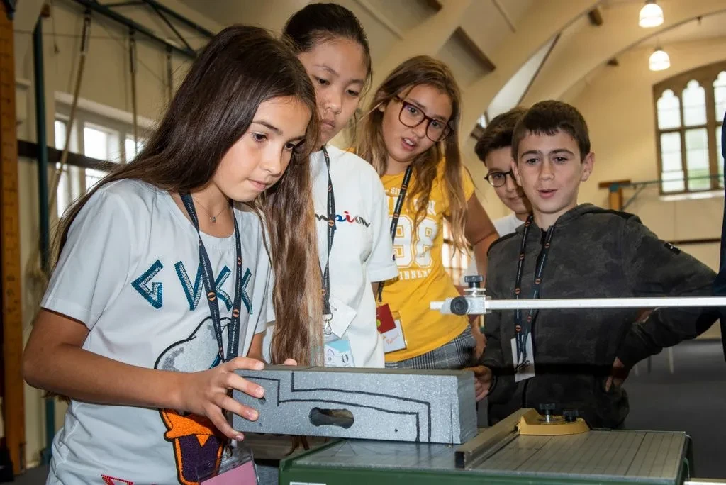 Kids looking at a project