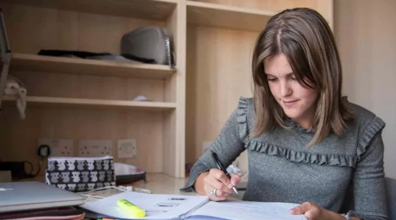 A girl writing in a notebook