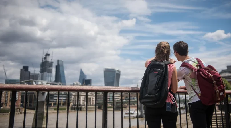 Two tourists pointing at the distance