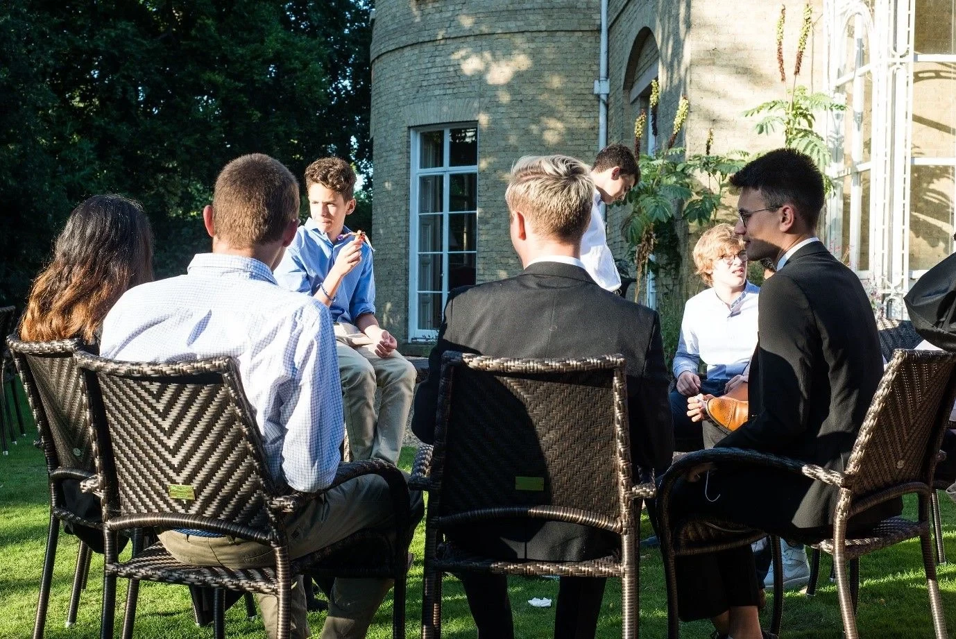Students sitting outside and chatting