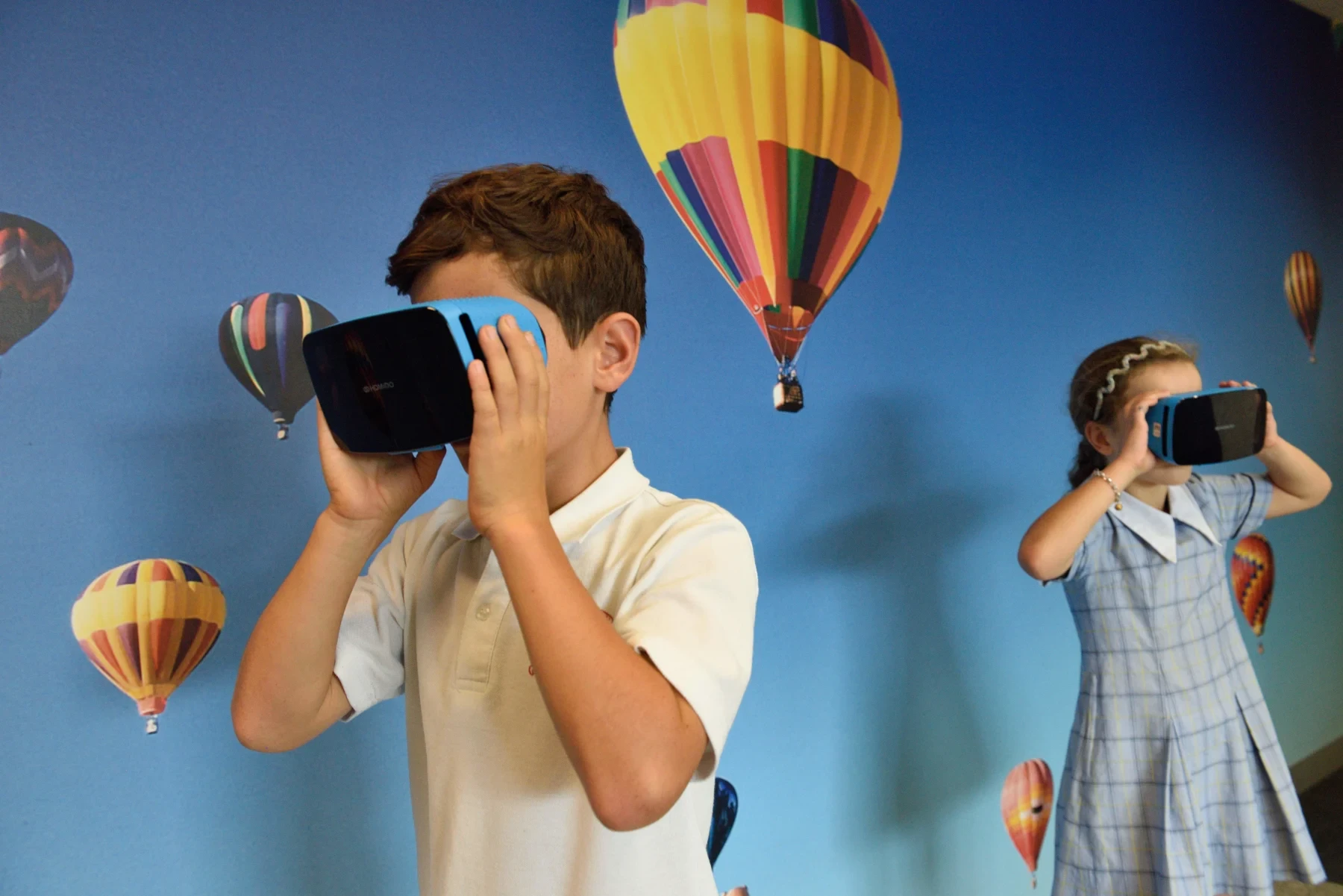 Children with virtual reality gadgets