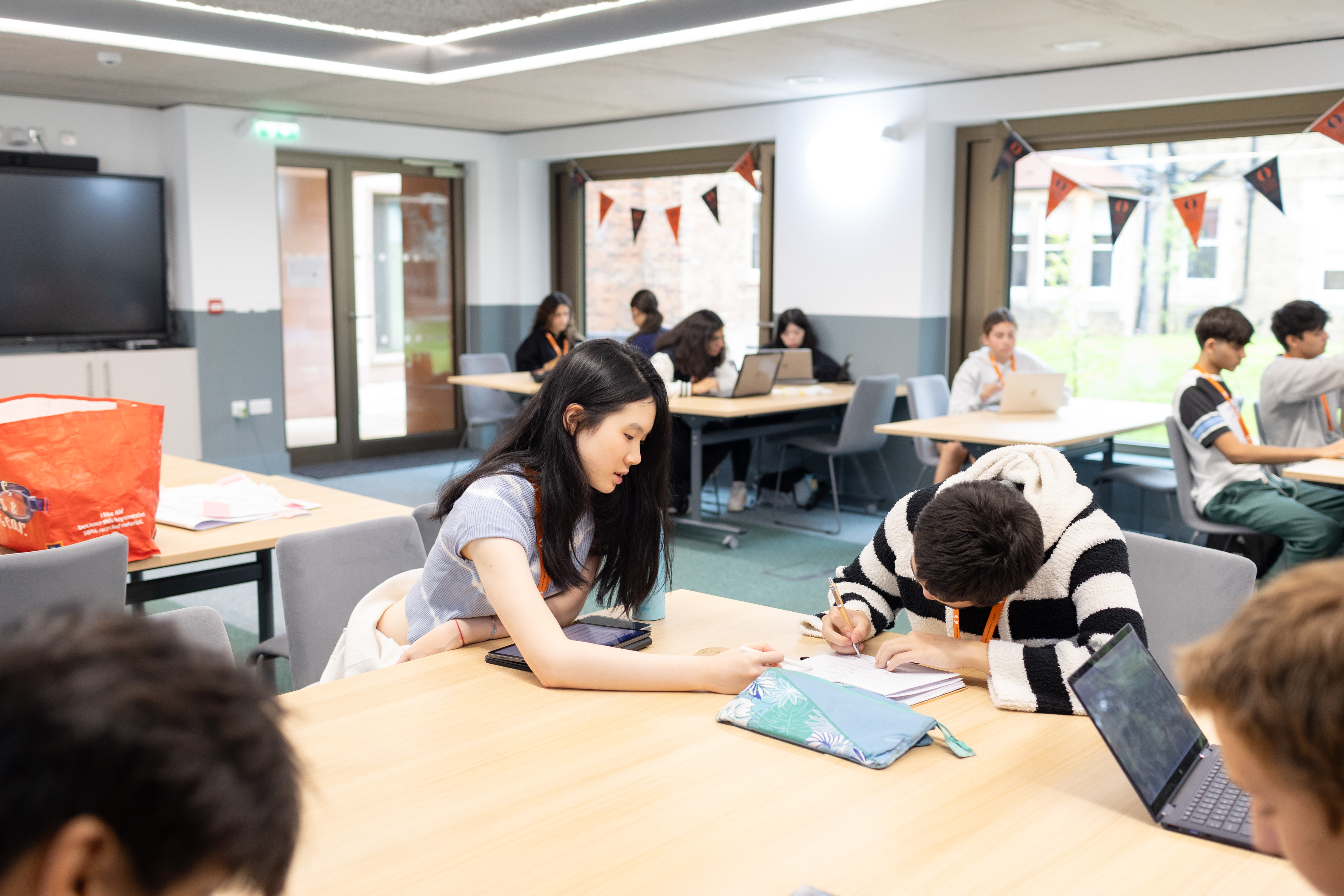 group of students reading in classroom