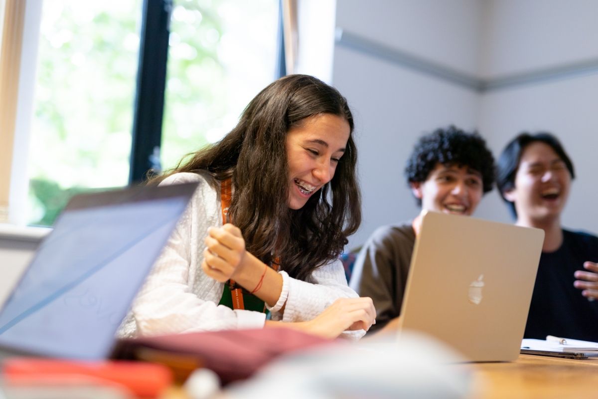 three students working in a small group
