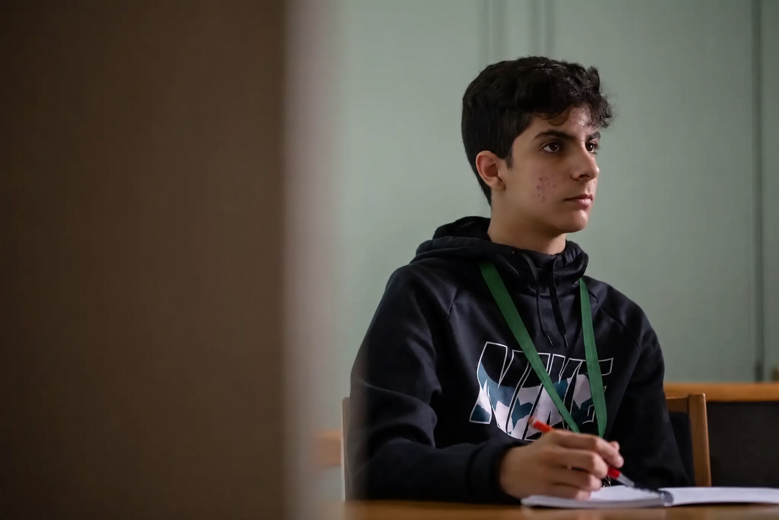 A student with a notebook