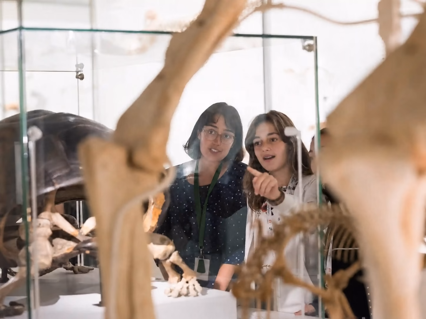 Two students looking at artifacts