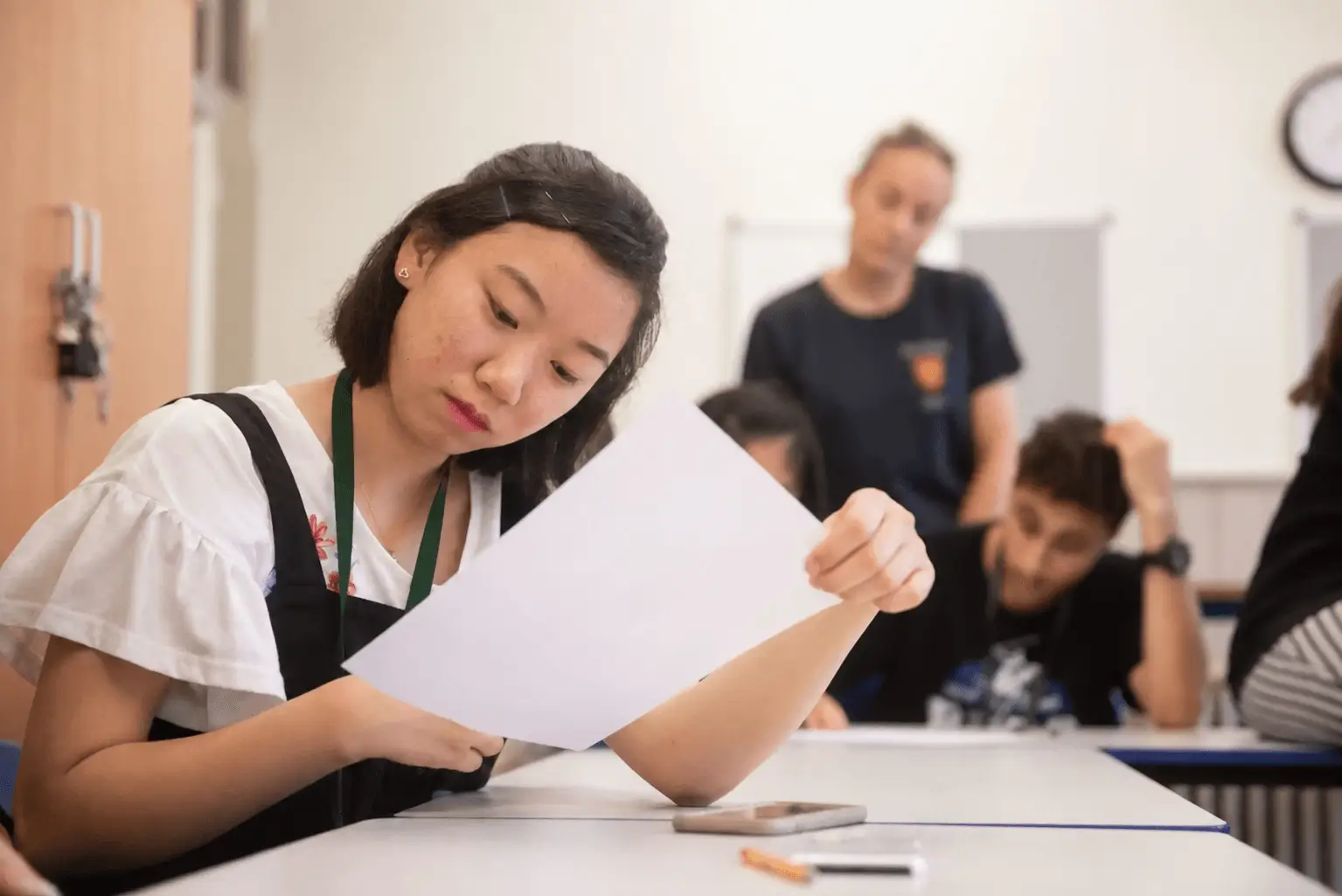 A girl looking at some papers