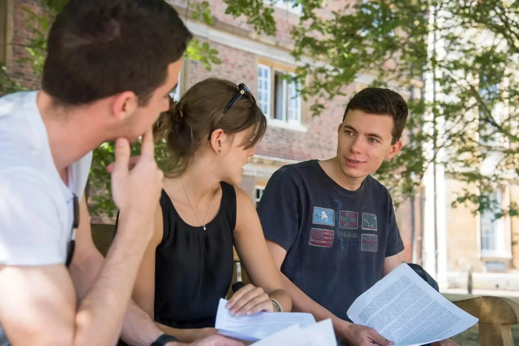 Three students having a discussion