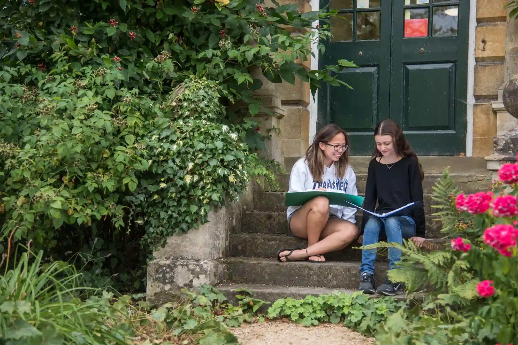 two girls sitting on the stairs