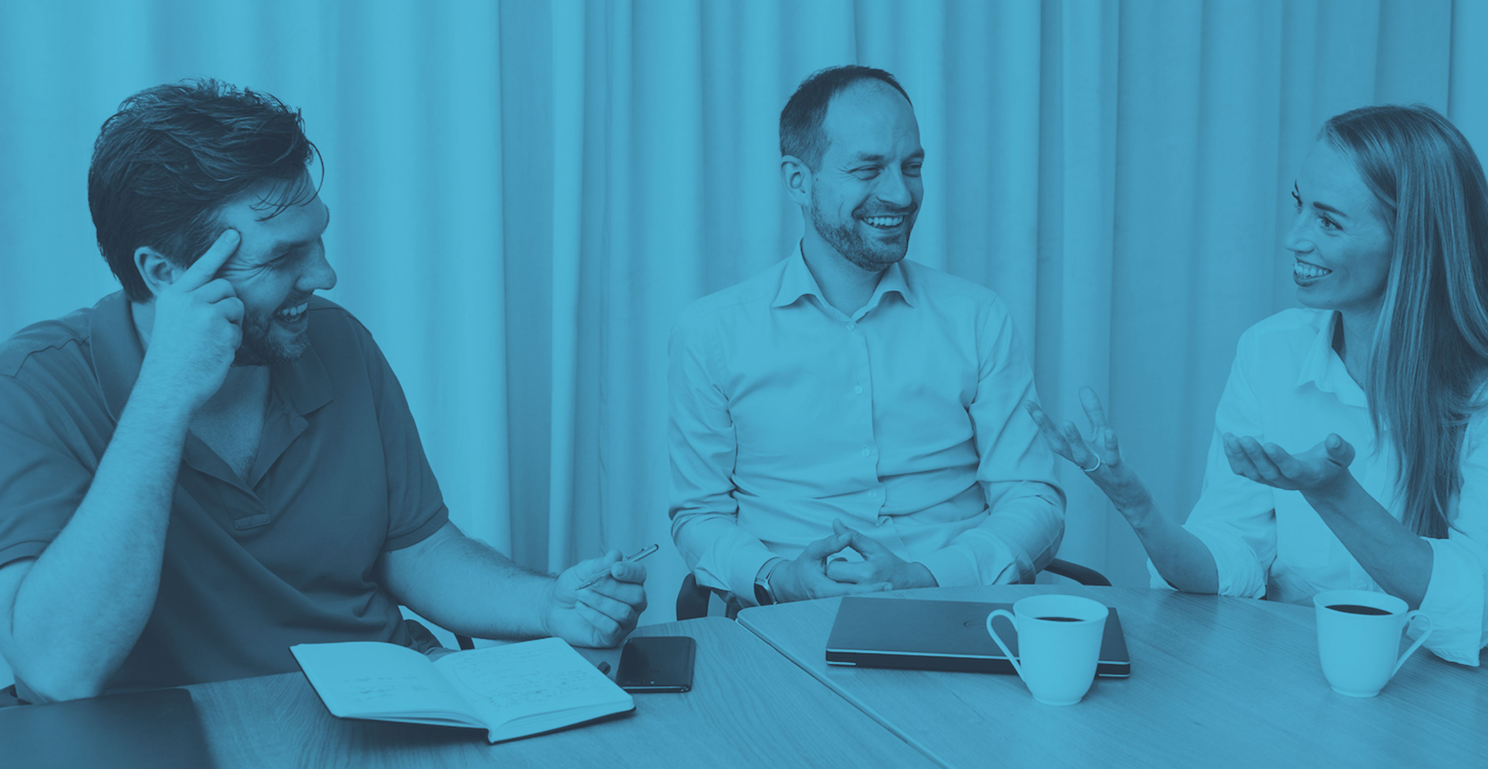 Lysa founders in conversation around a table