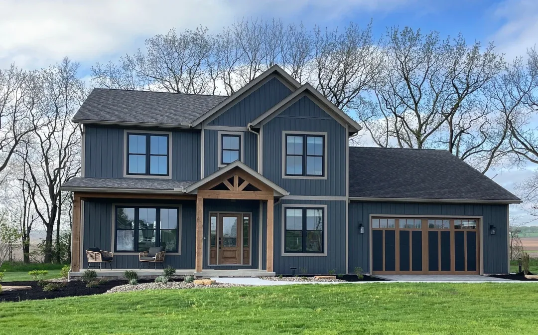 front of home with trees in background