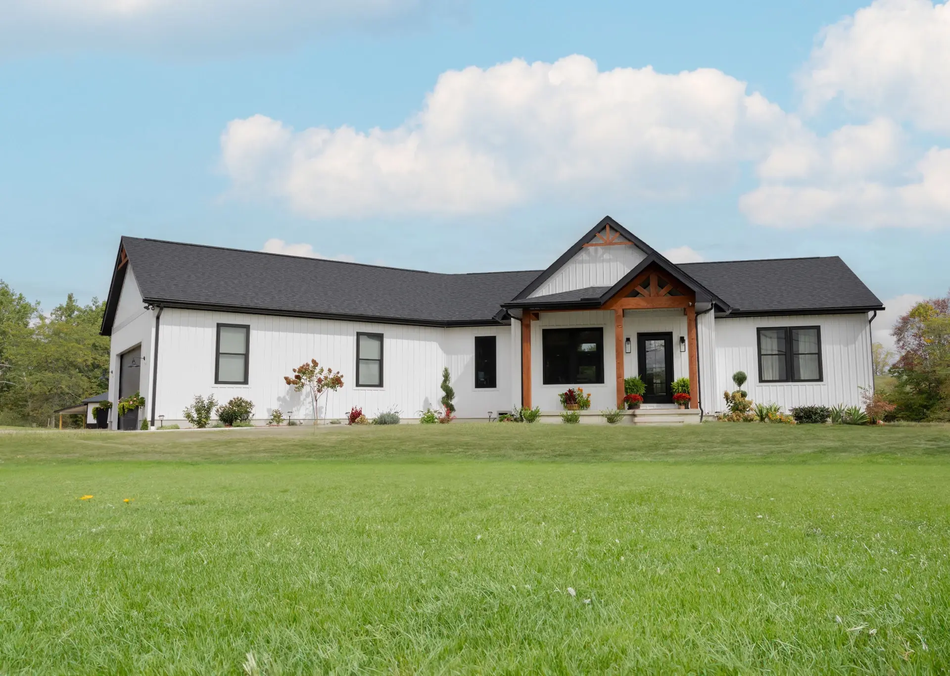 newly built home with lush green grass