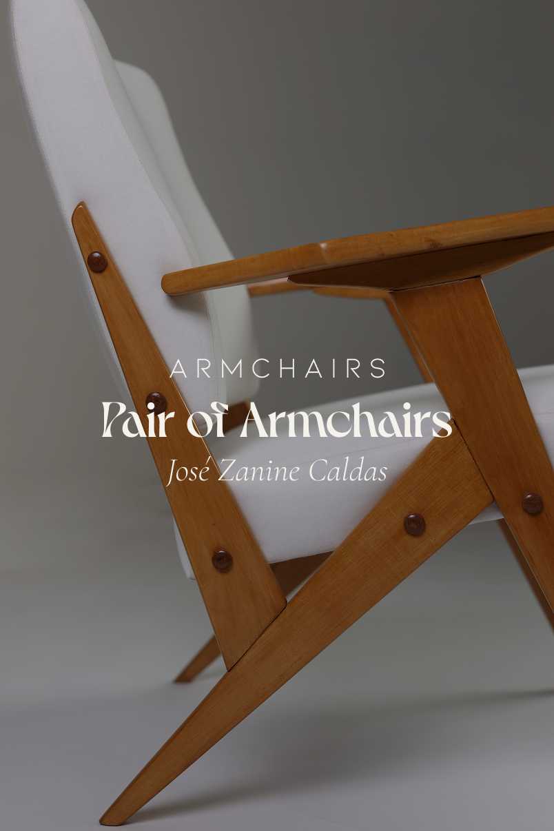 Pair of armchairs by José Zanine Caldas - full front view of a single chair with solid wood frame and light upholstery