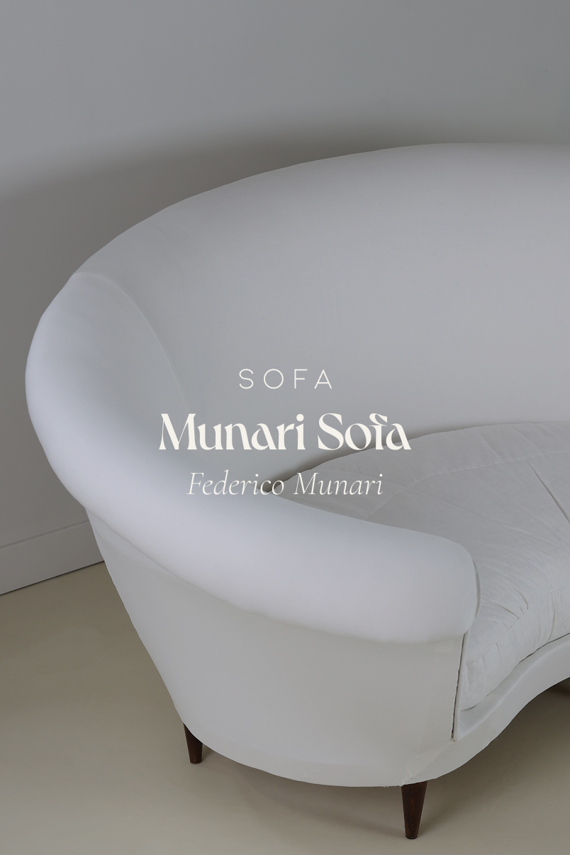 Munari curved sofa by Federico Munari - full front view showing its organic serpentine shape and cream upholstery
