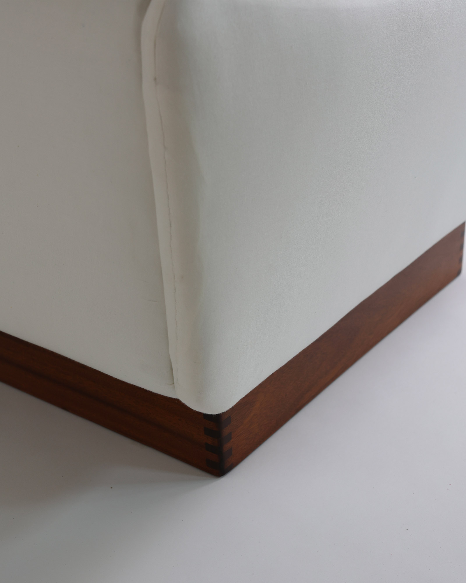 Teckel sofa by Michel Mortier - detailed view of the dark wood base and fabric