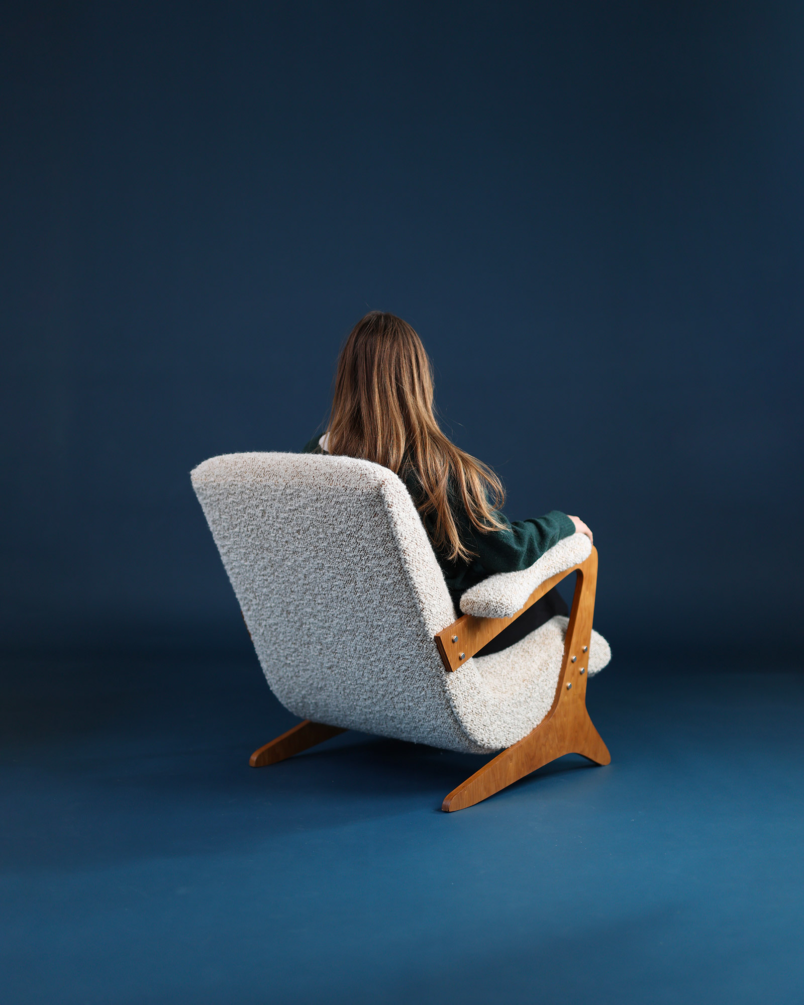 Zeca armchair by José Zanine Caldas - rear three-quarter view showcasing the backrest design and proportions