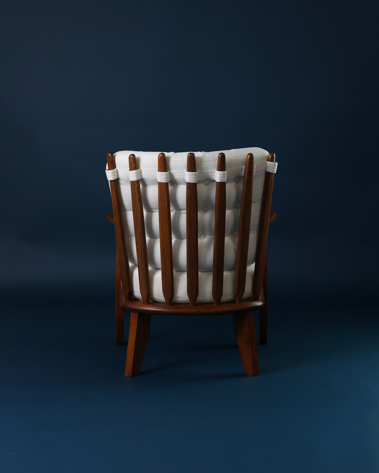 Catherine armchair by Guillerme et Chambron - rear view detailing the signature wooden spindle backrest structure