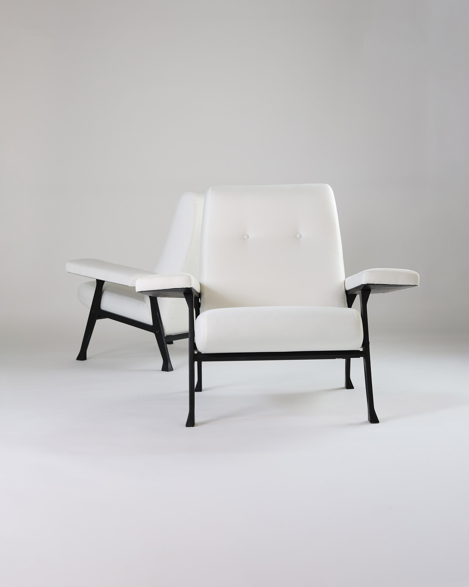 Hall armchair by Roberto Menghi - full front view featuring white upholstery and a black metal frame on a light background