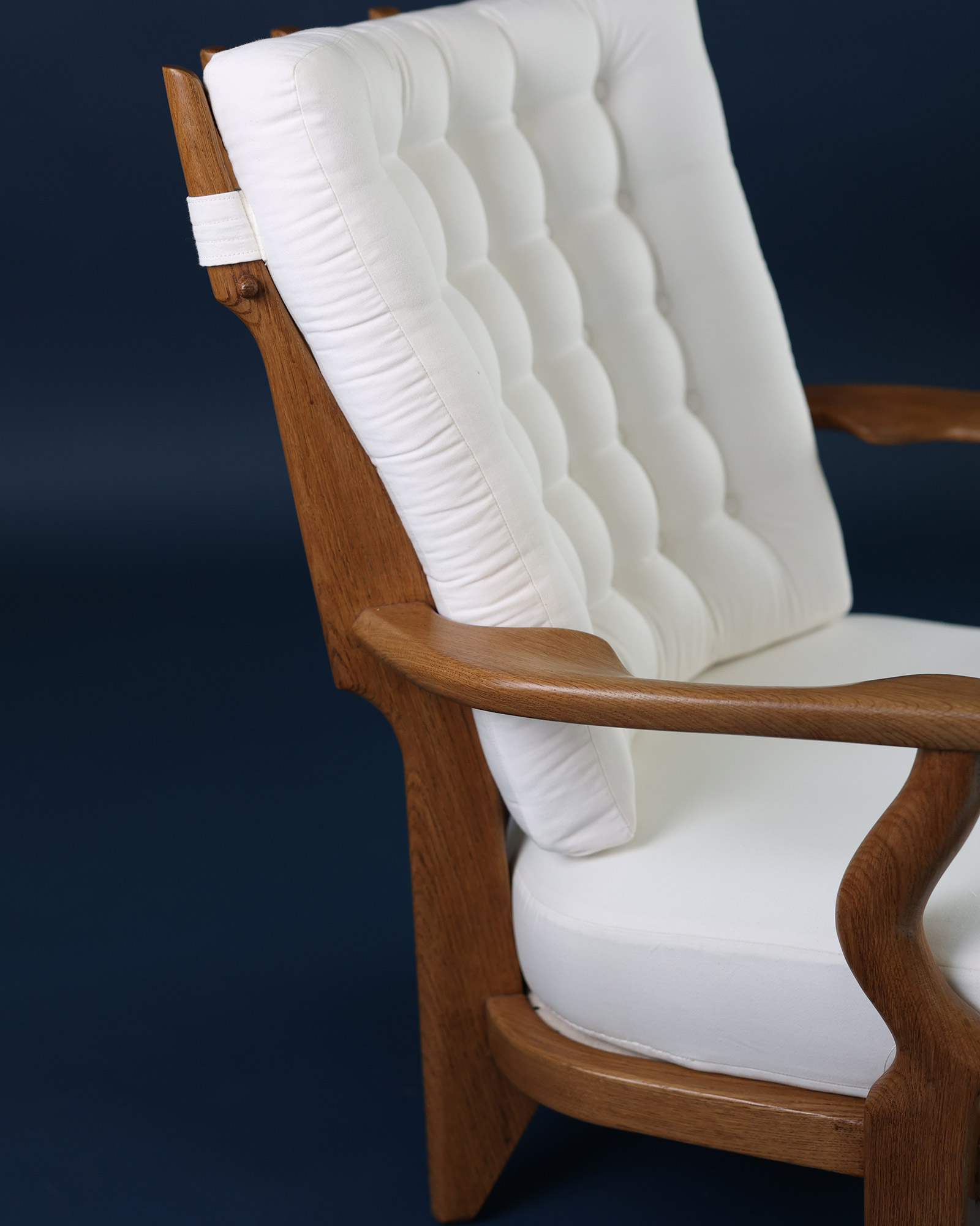 Petit Repos armchair by Guillerme et Chambron - rear view detailing the signature wooden spindle backrest design