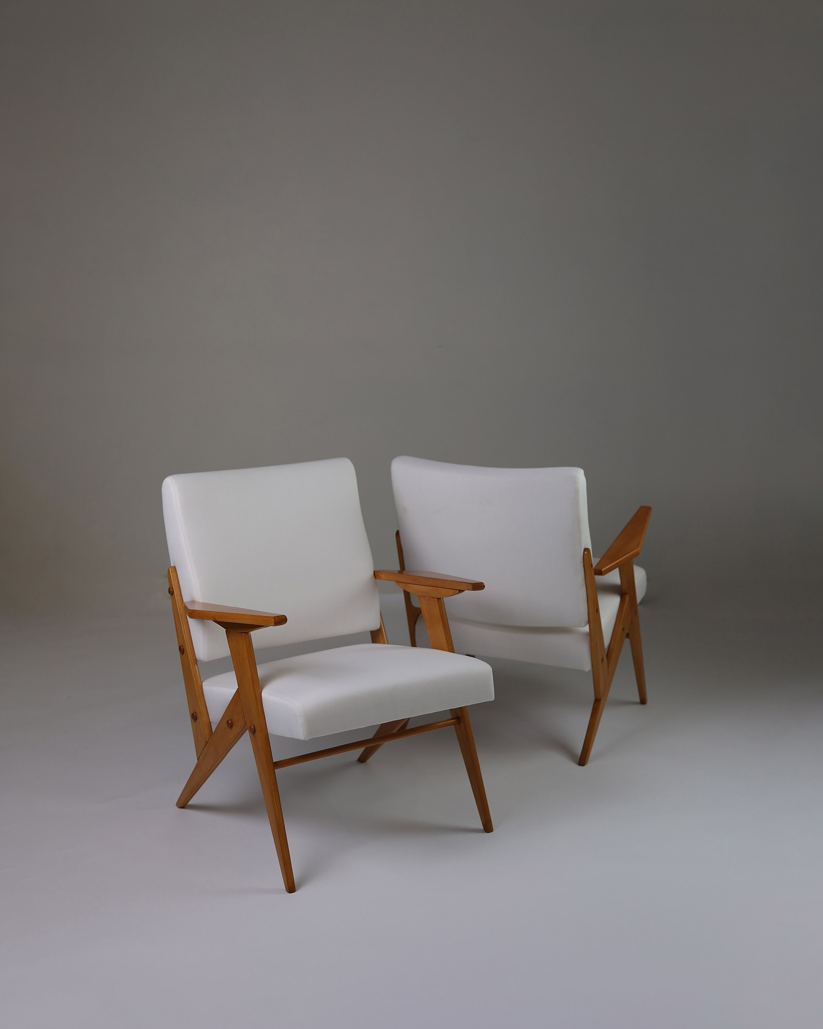 Pair of armchairs by José Zanine Caldas - duo shot displaying both matching chairs in a studio setup