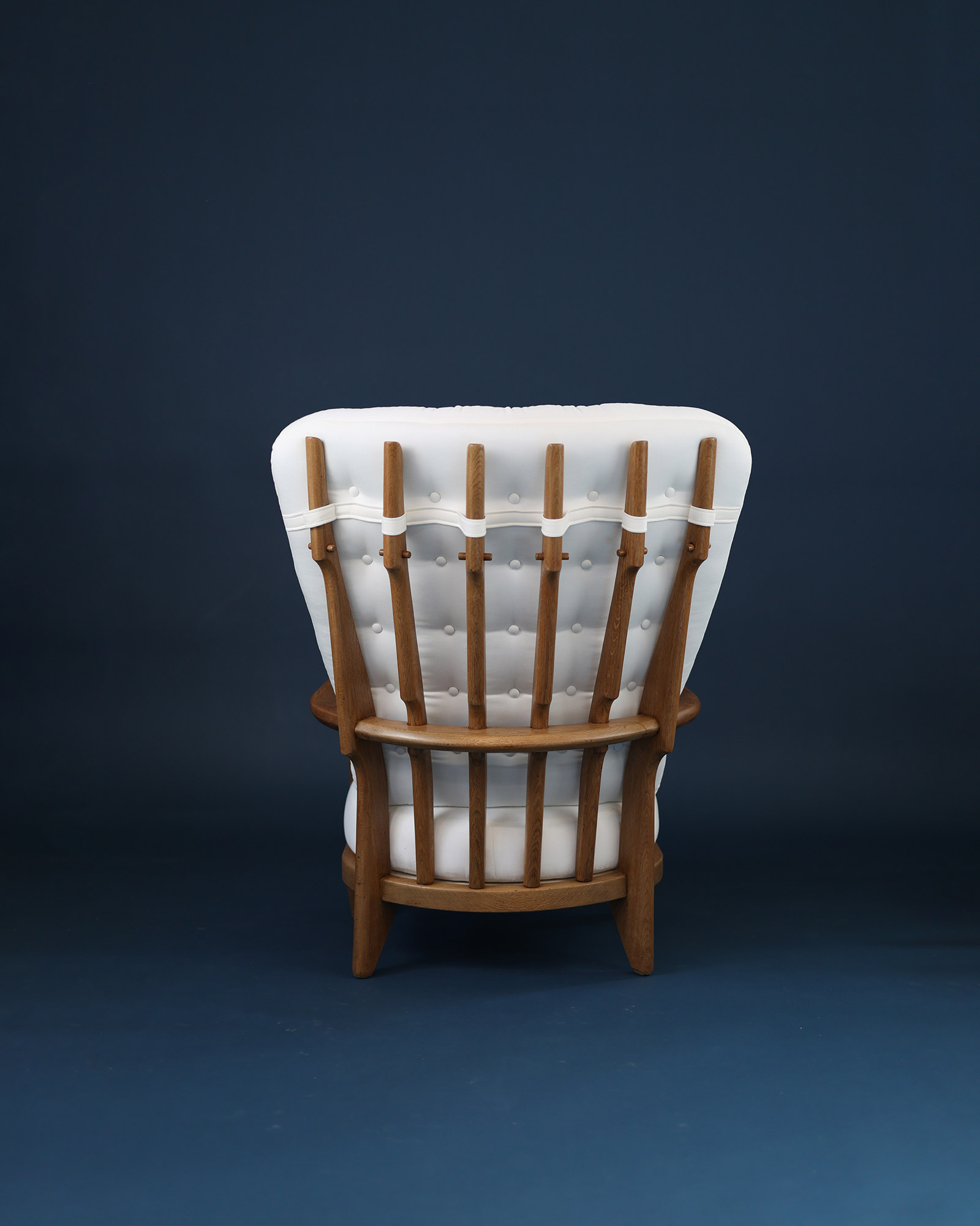 Grand Repos armchair by Guillerme et Chambron - rear view detailing the signature wooden spindle backrest construction