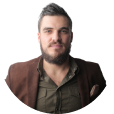 Profile picture of a man with a beard using a shirt and casual suit.