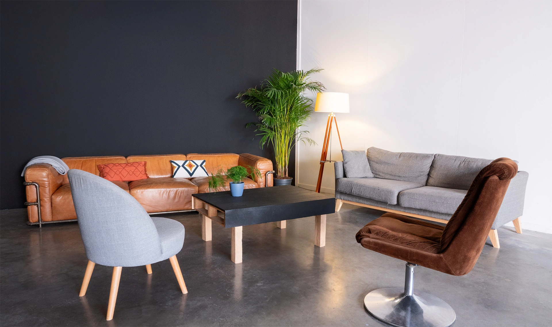 Client lounge with leather and fabric sofas at Spline's Set B filming studio