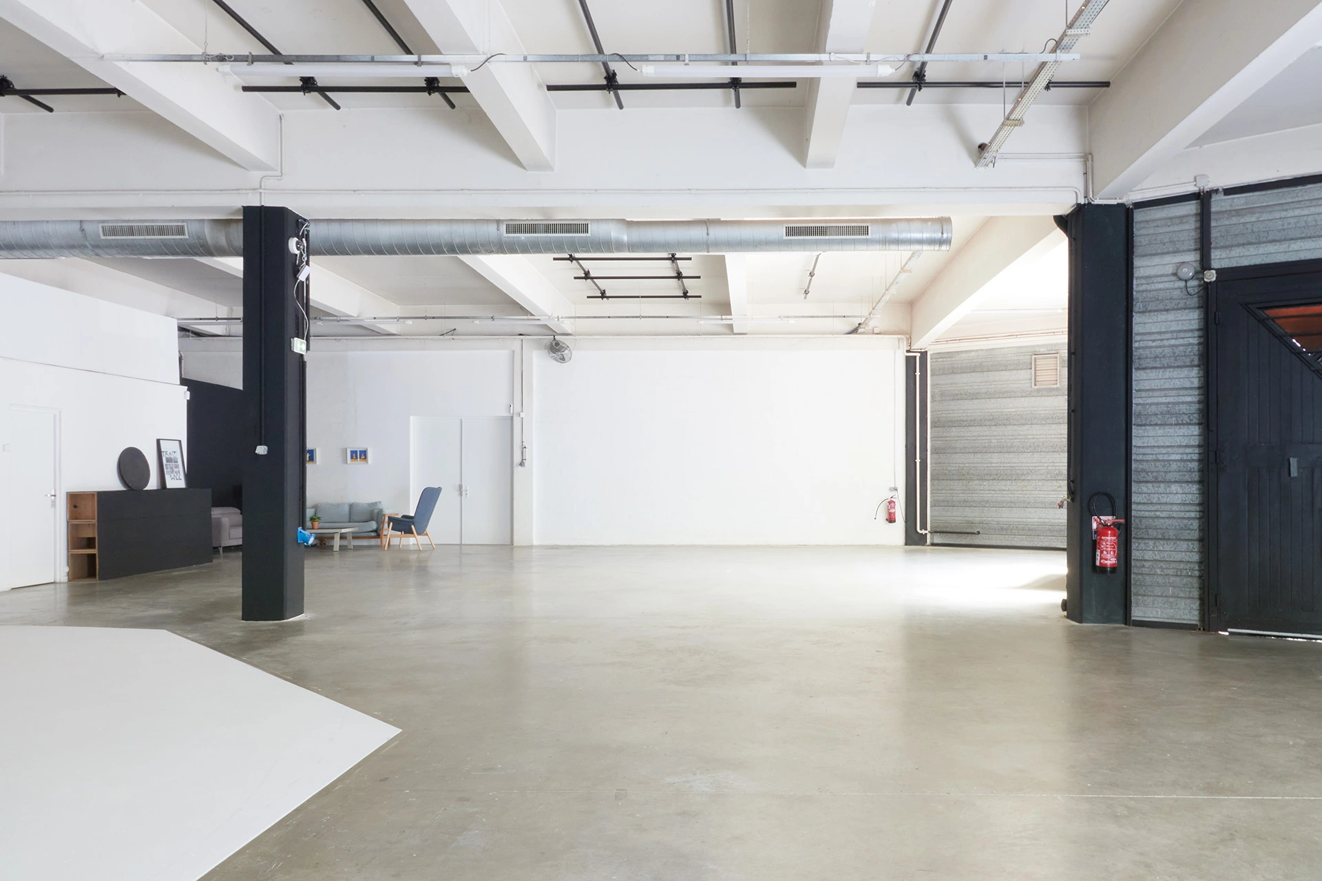 Secondary white set space with lighting grid next to Set A at Spline studios