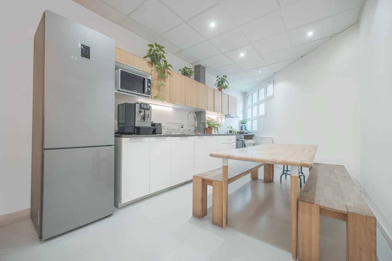 Fully equipped crew kitchen with dining table at Spline's filming studios