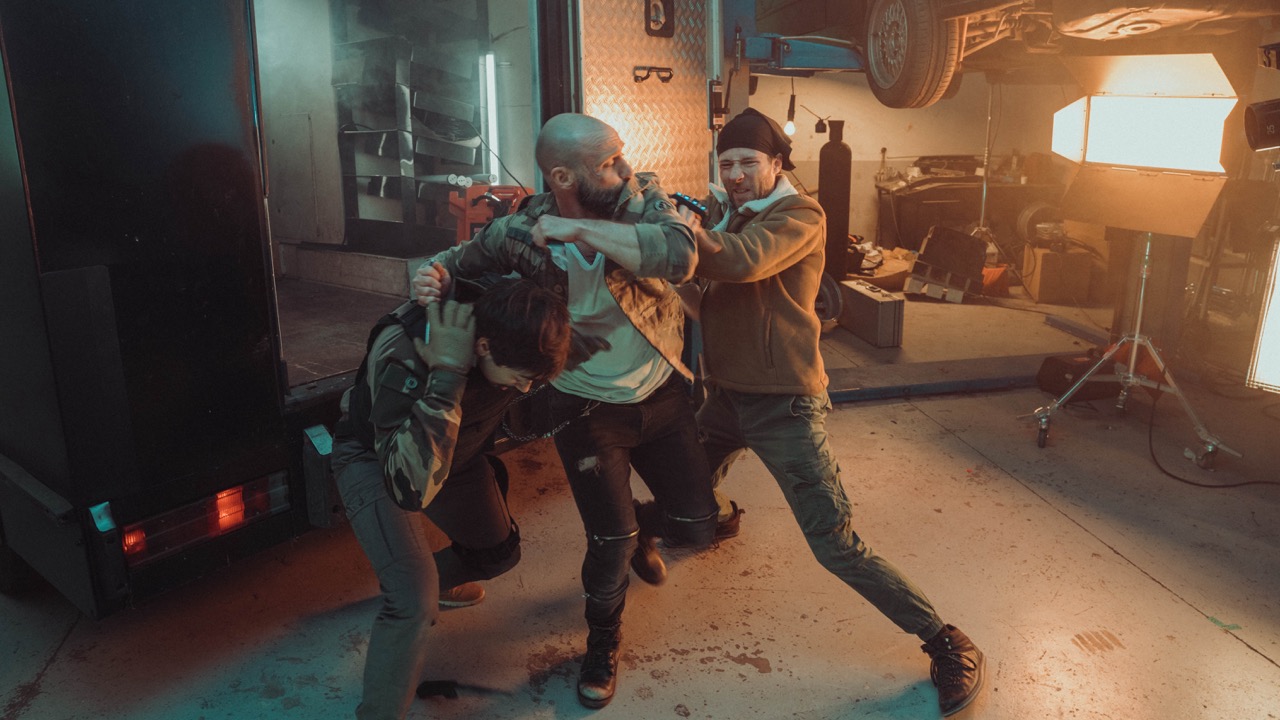 Fight scene staged in a garage set, shot with motion control for VFX post-production