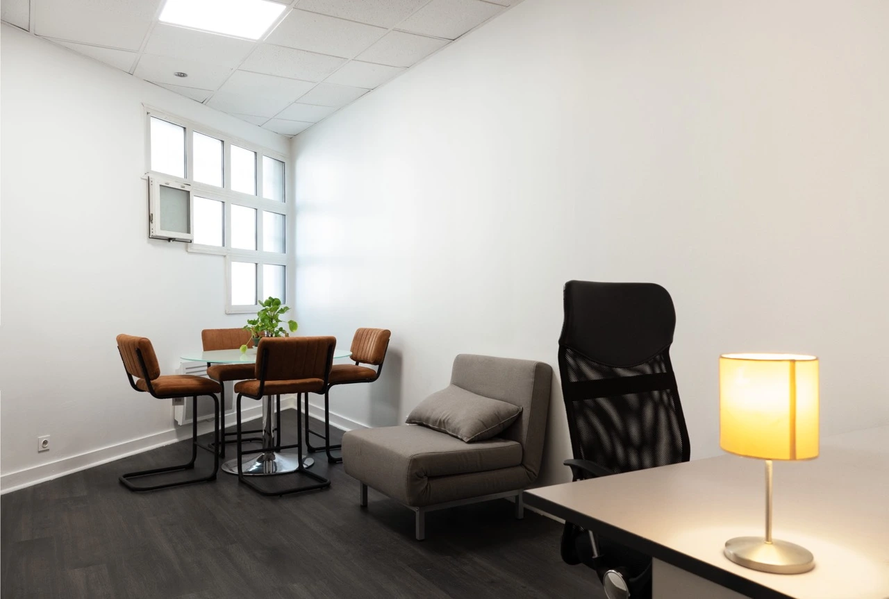 Production office with meeting table and armchairs at Spline's filming studios