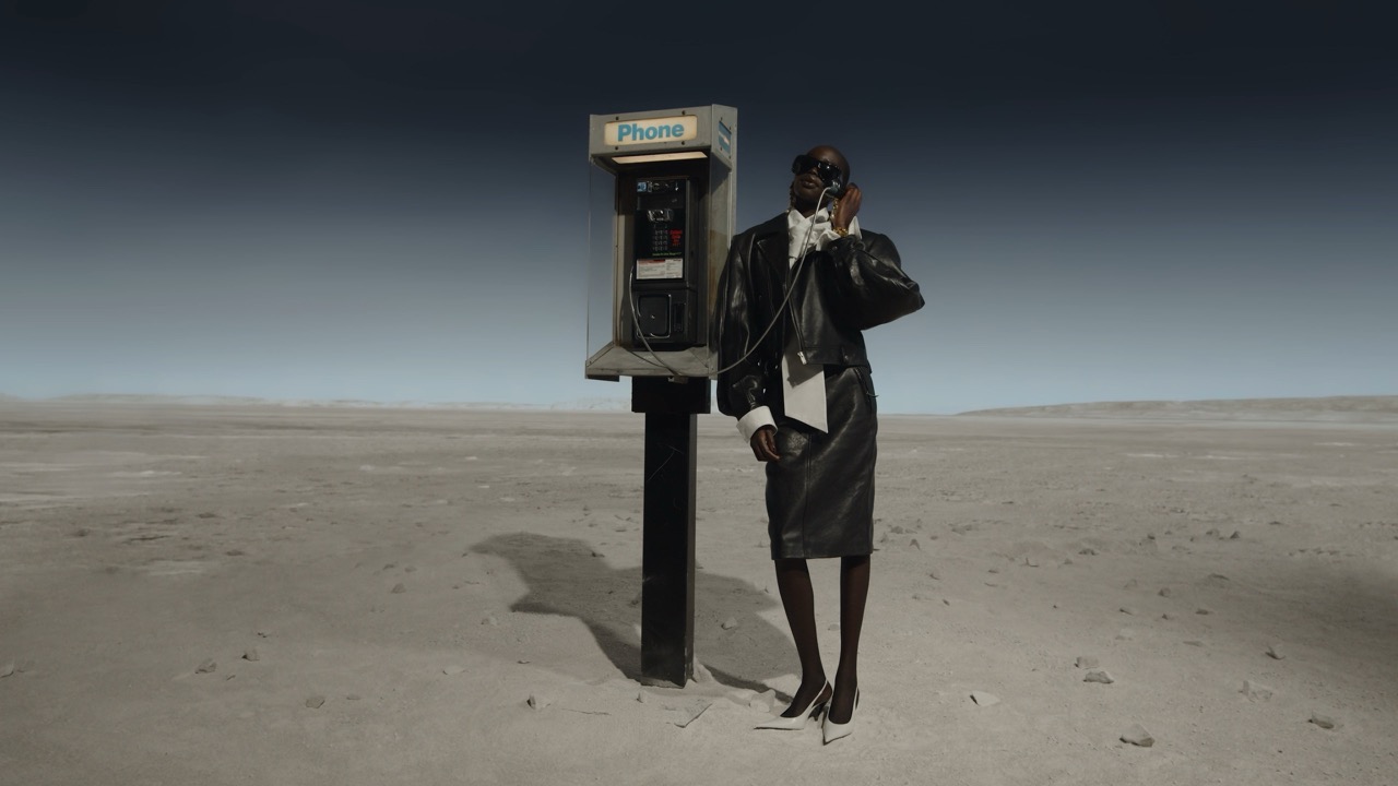 Spline Project Telephone booth against a desert background