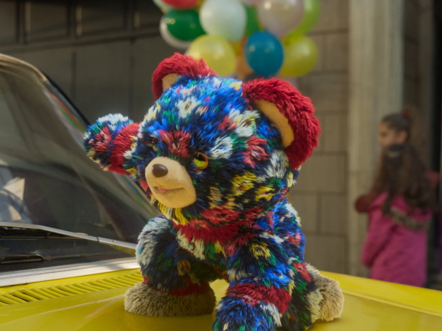 Multicoloured fur teddy bear surrounded by balloons, VFX and post-production shot