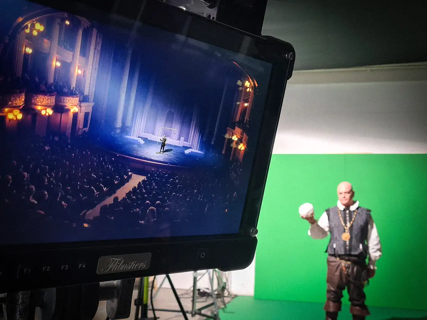 On-set monitor showing draft CGI composited in real time over a riverside location shot