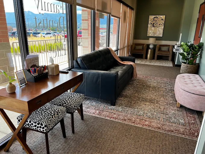 Modern dental office reception area with comfortable seating natural lighting and welcoming patient waiting space