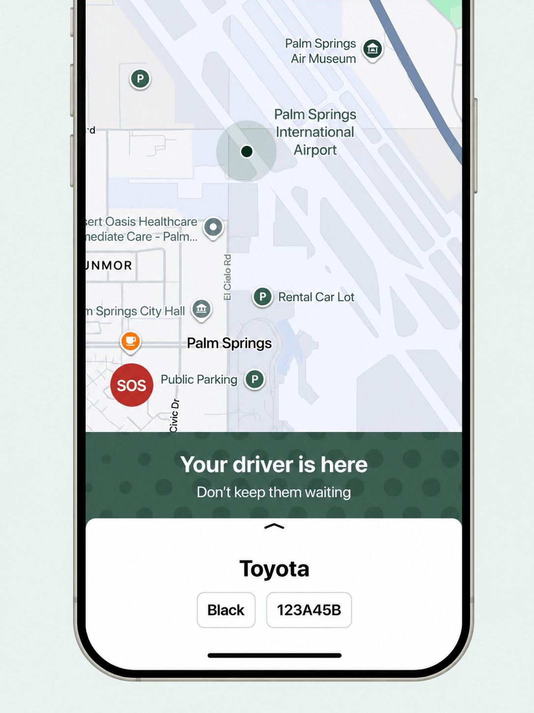Map on phone showing Palm Springs area with message 'Your driver is here' and Toyota car details.
