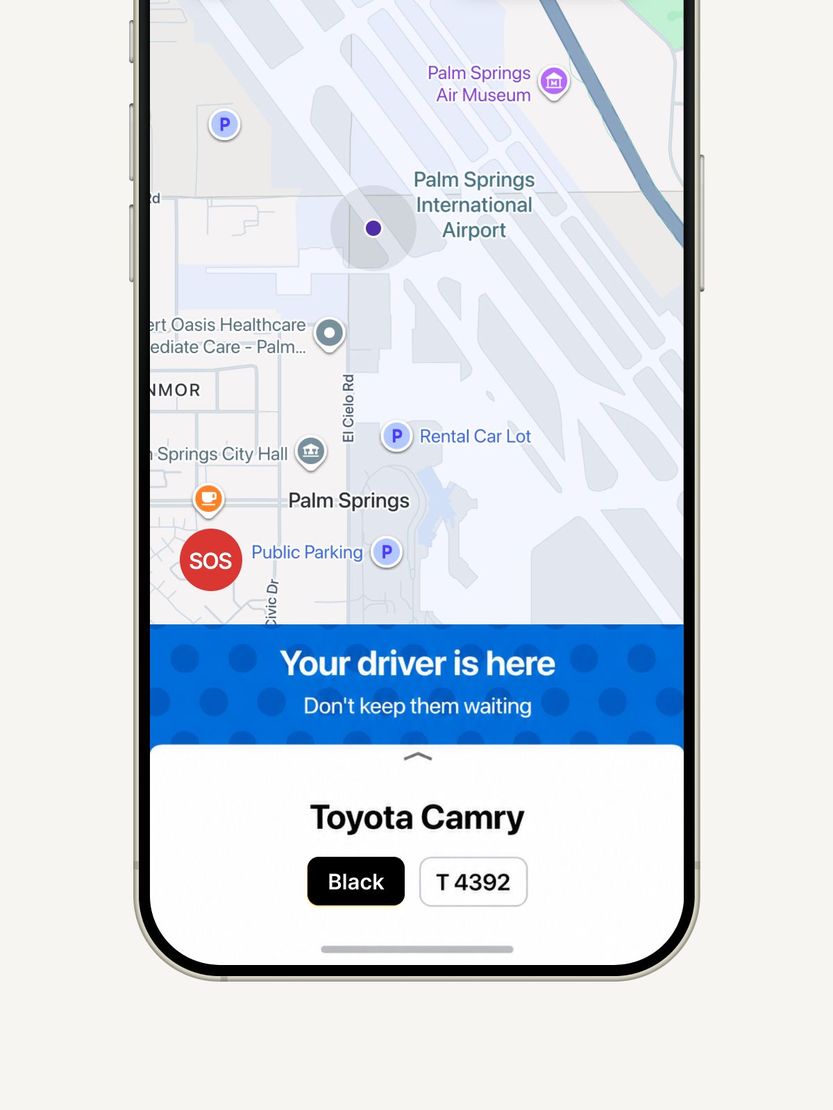 Ride app showing driver location at Palm Springs Airport, Toyota Camry black car, license T 4392.
