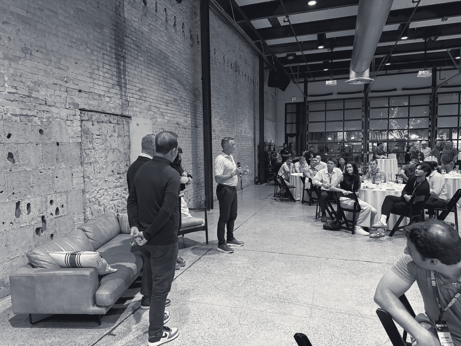 A guest speaker addresses an audience at a Watchtower event