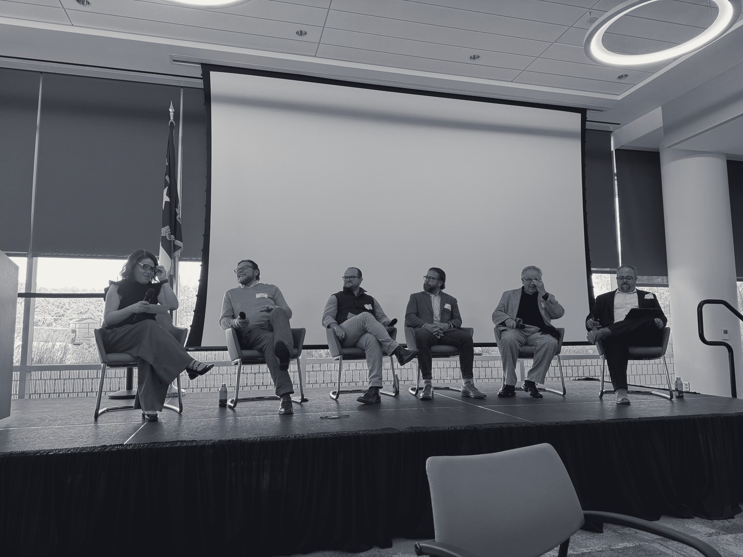 A panel of experts speaks at a Watchtower event
