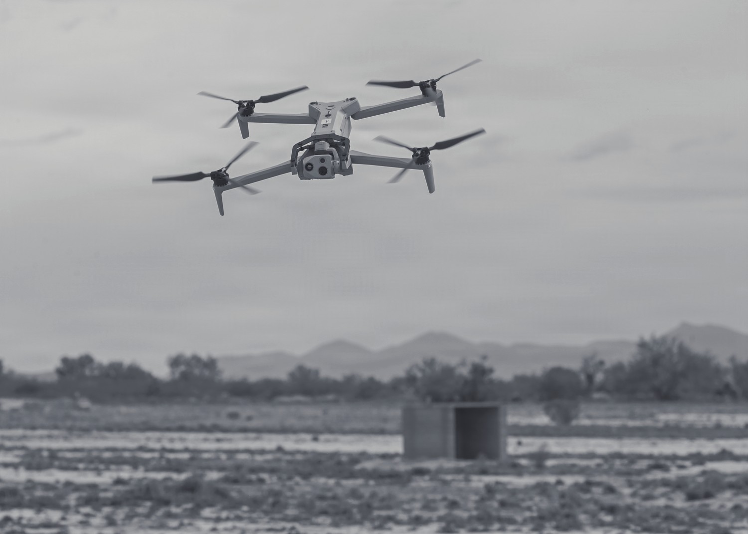 A team member watching a drone in the field