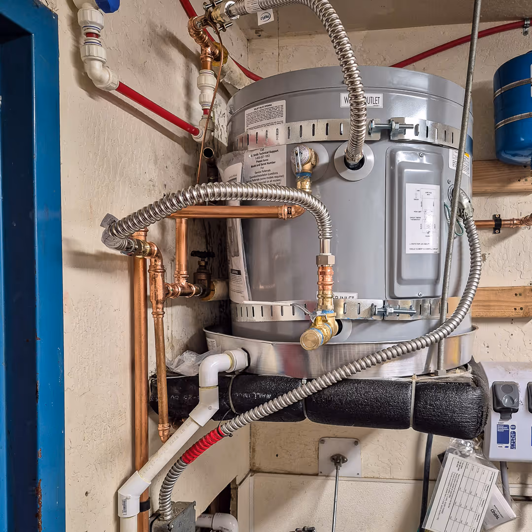 licensed plumber installing water heater