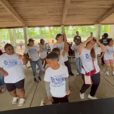 Students in Senior Things Class of 2025 shirts dancing at outdoor pavilion