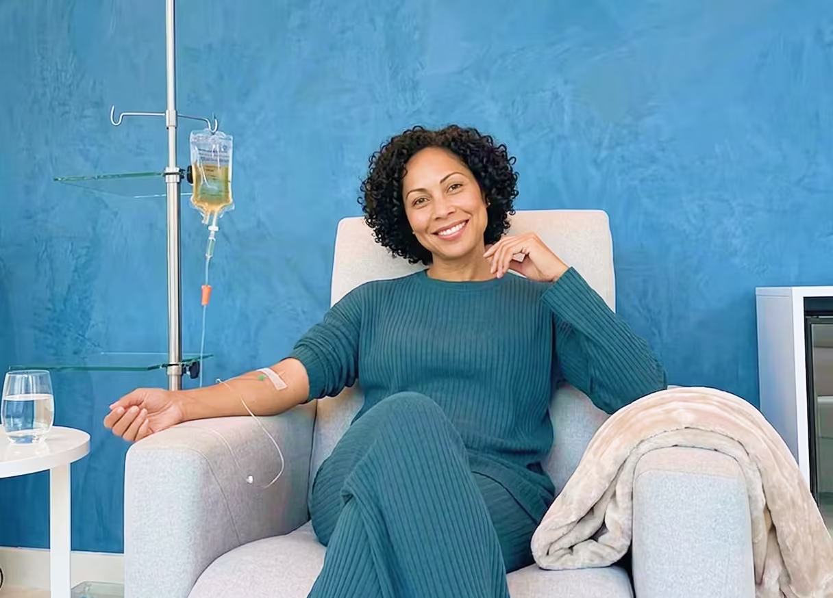Patient relaxing during a physician-supervised IV infusion at the Nexsis BioHealth clinic in Brickell, Miami