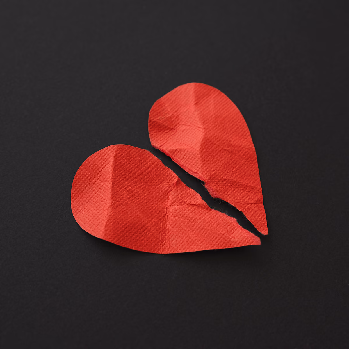 Red paper heart torn in two. Betrayal Trauma Recovery Group for Women | McKinney TX