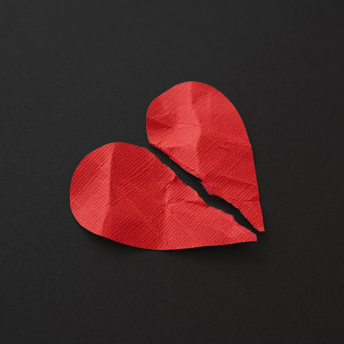 Red paper heart torn in two. Betrayal Trauma Recovery Group for Women | McKinney TX